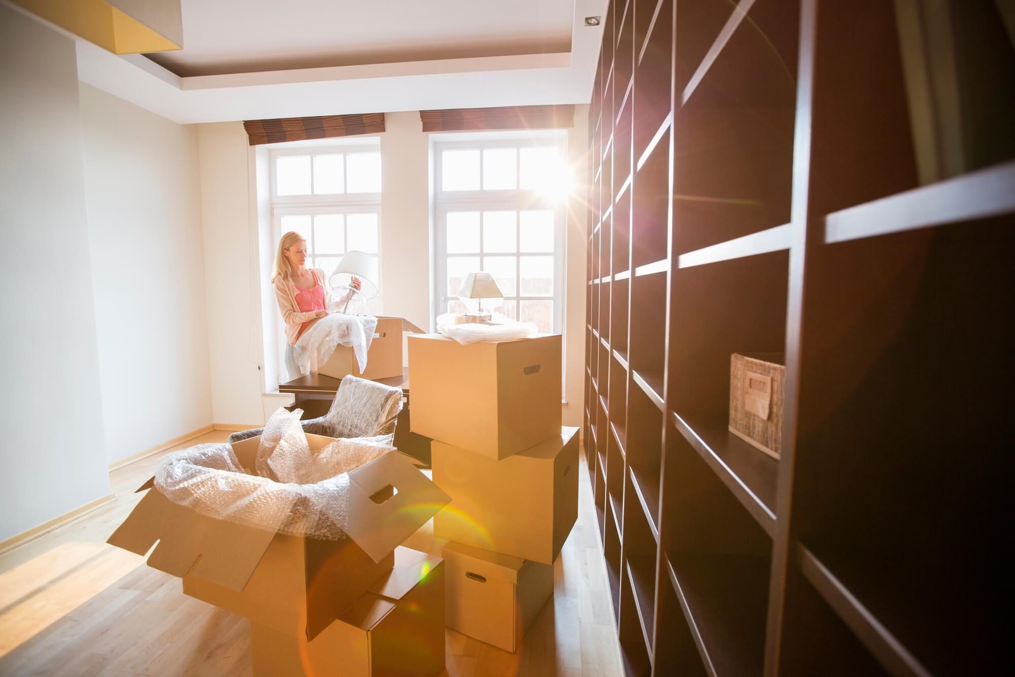 woman in her new home after contacting moving companies in west palm beach