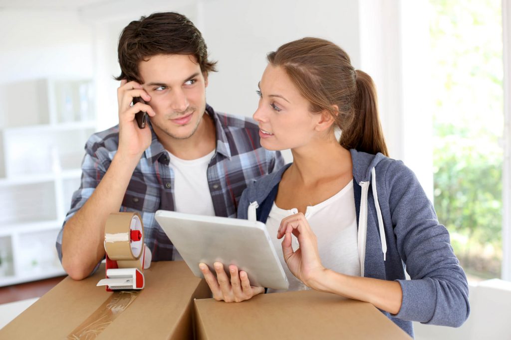 a-couple-contacting-local-moving-companies-in-west-palm-beach
